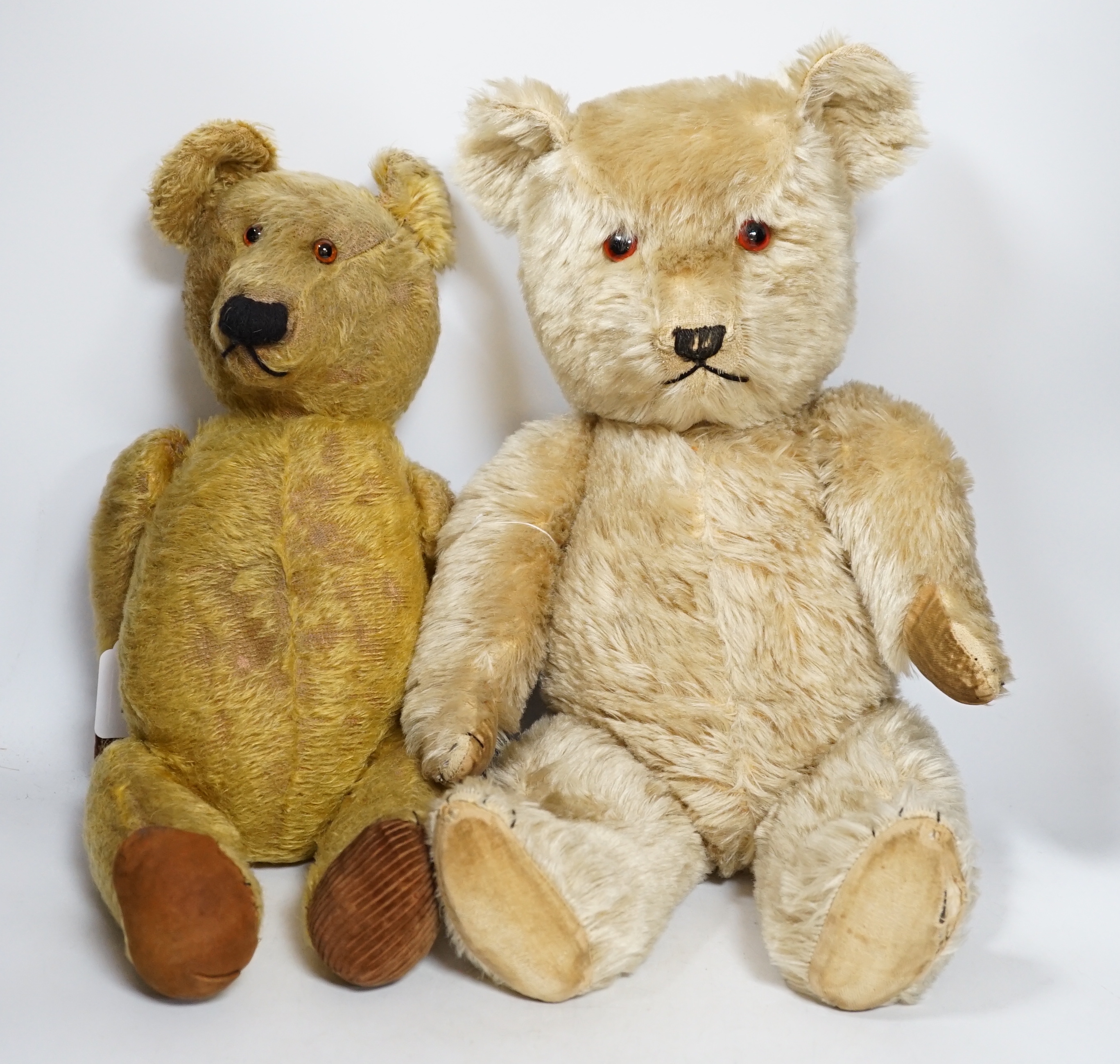 A Chiltern bear c.1950's, 55cm, tear to one velvet pad otherwise in good condition, and a 1930's bear, 50cm, repaired paw pads and nose